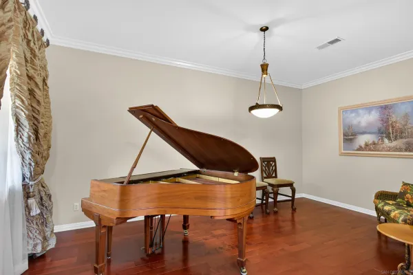 a dining room with furniture and wooden floor