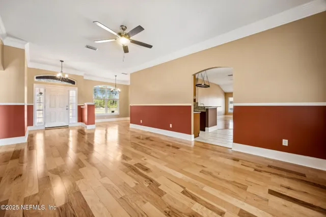 a kitchen with stainless steel appliances granite countertop a sink and a refrigerator