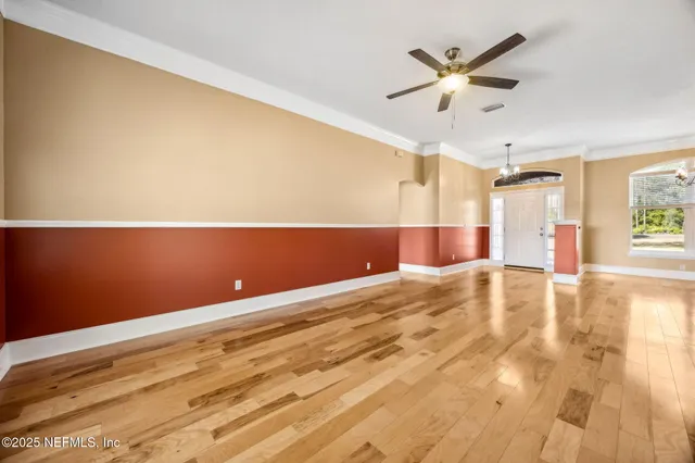 a kitchen with stainless steel appliances granite countertop a refrigerator a stove and a sink