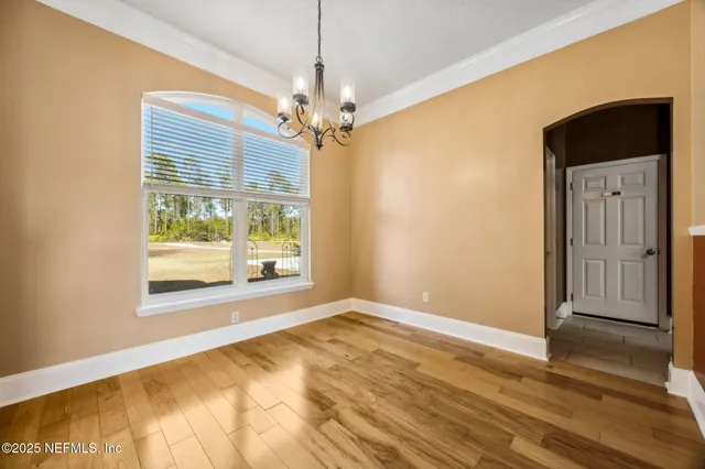 a kitchen with stainless steel appliances granite countertop a refrigerator a stove and a sink