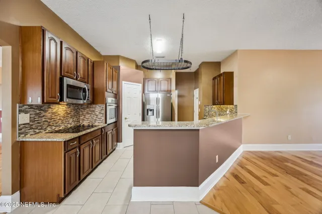 a spacious bathroom with a double vanity sink and a mirror