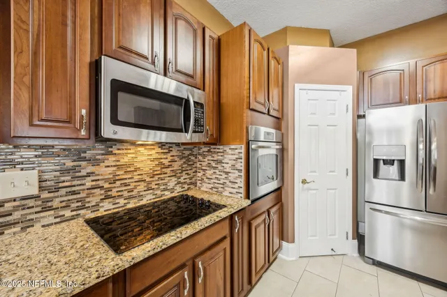 a view of room with window and ceiling fan