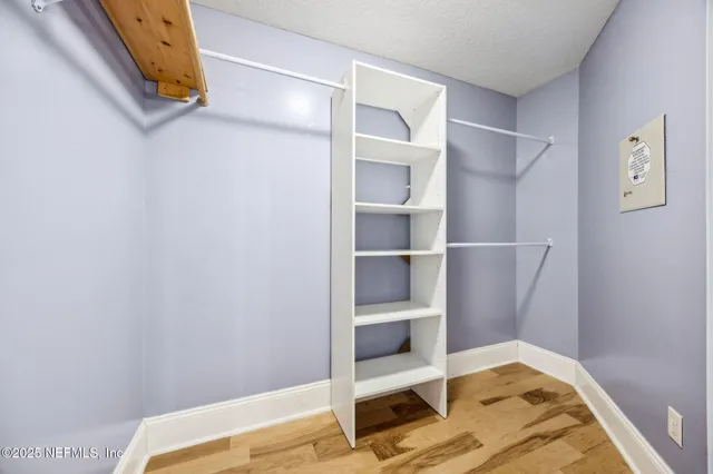 a view of a lake with houses in the back