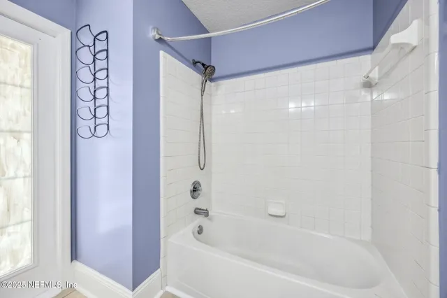 an aerial view of a house with lake view