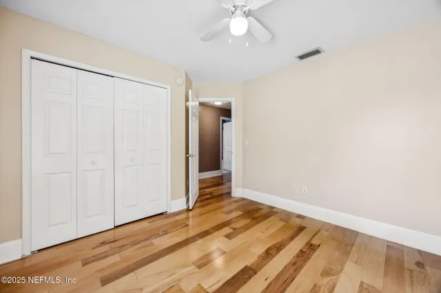 an aerial view of a house with a lake view