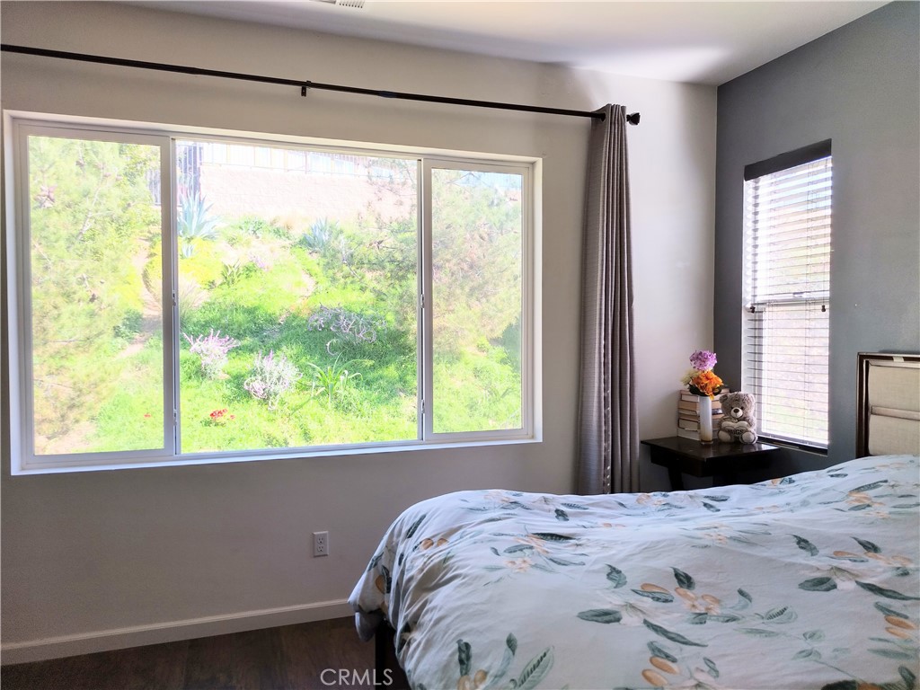 11811 Cramer Road Yucaipa, CA 92399 - Photo 31 of 56 a bedroom with a bed and a large window