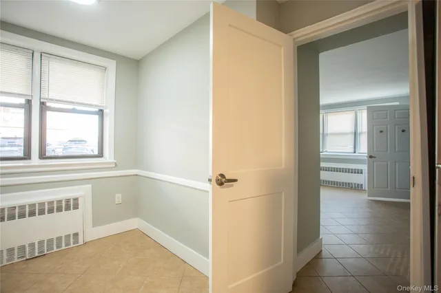 a view of an empty room with a window