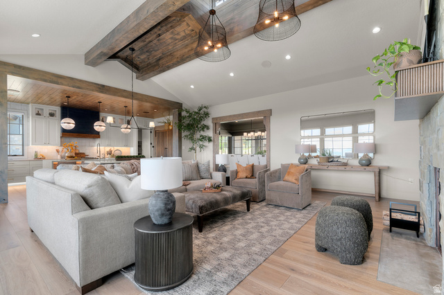 2192 East Outlaw Road Kamas, UT 84036 - Photo 76 of 80 Vaulted ceiling with exposed wood beams, wood-finish flooring, recessed lighting, and a stone-clad fireplace