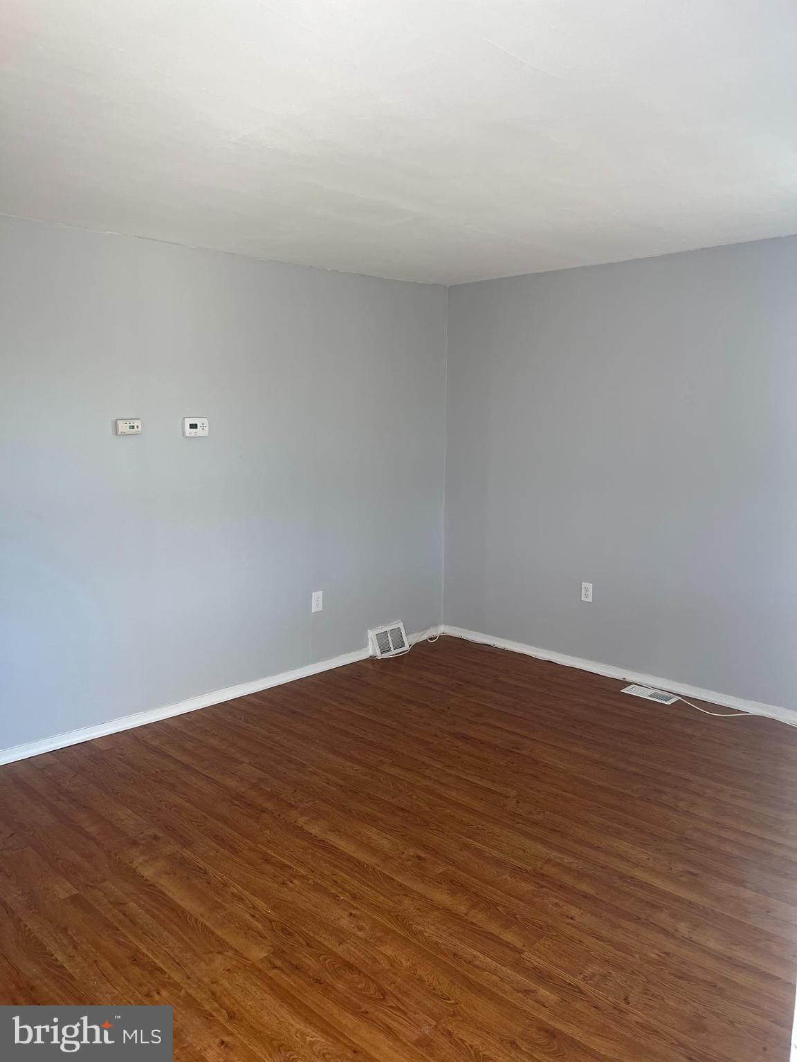 19 West Maiden Lane Somerdale, NJ 08083 - Photo 3 of 12 a view of an empty room with wooden floor