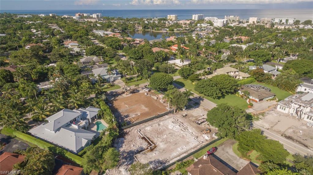 1952 Crayton Road Naples, FL 34102 - Photo 2 of 7 an aerial view of residential houses with outdoor space