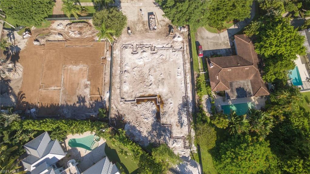 1952 Crayton Road Naples, FL 34102 - Photo 5 of 7 an aerial view of a house with a yard and garden