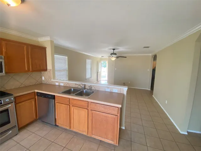 a kitchen with a sink and cabinets