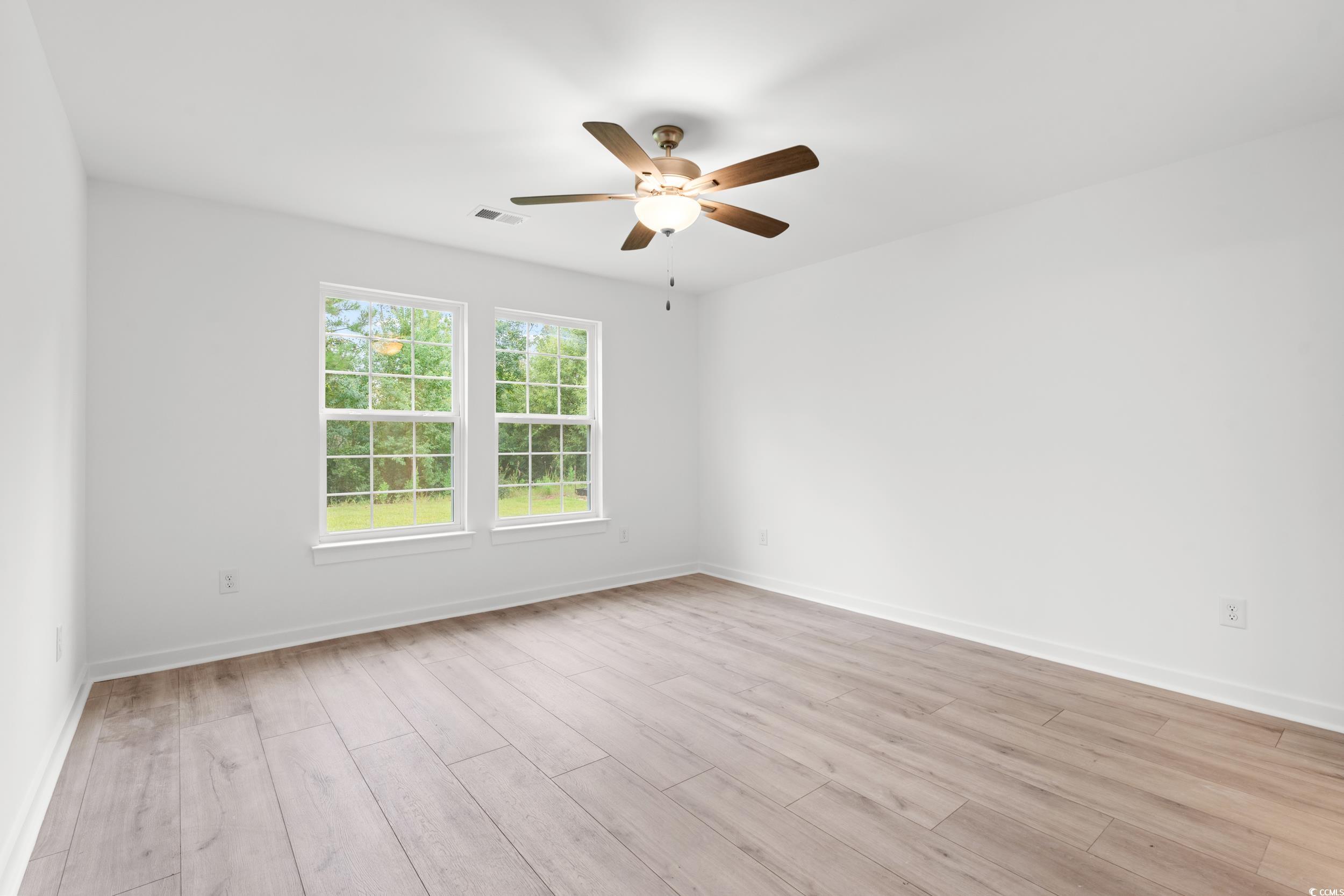 2827 Biscane Court Conway, SC 29527 - Photo 10 of 31 Unfurnished room with light wood-style flooring and a ceiling fan