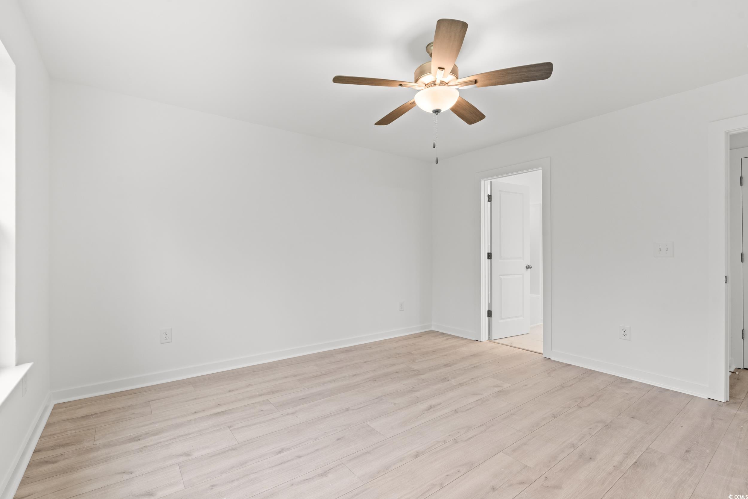 2827 Biscane Court Conway, SC 29527 - Photo 11 of 31 Unfurnished bedroom with a ceiling fan and light wood-style flooring