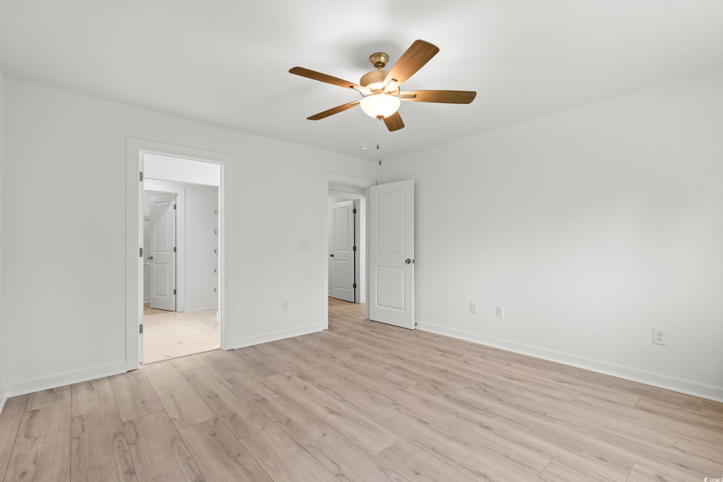 2827 Biscane Court Conway, SC 29527 - Photo 12 of 31 Unfurnished bedroom featuring light wood finished floors, ceiling fan, and ensuite bath