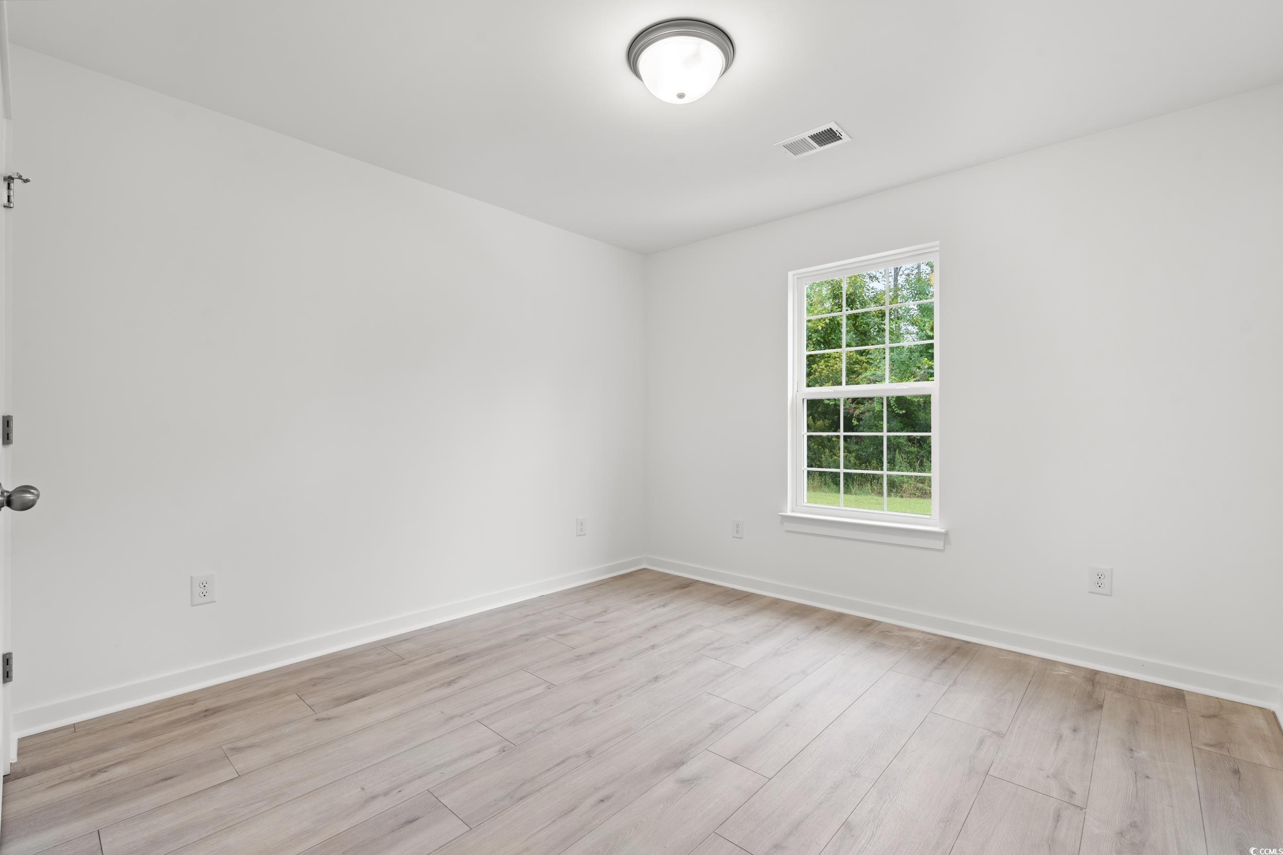 2827 Biscane Court Conway, SC 29527 - Photo 15 of 31 Empty room with baseboards and light wood finished floors