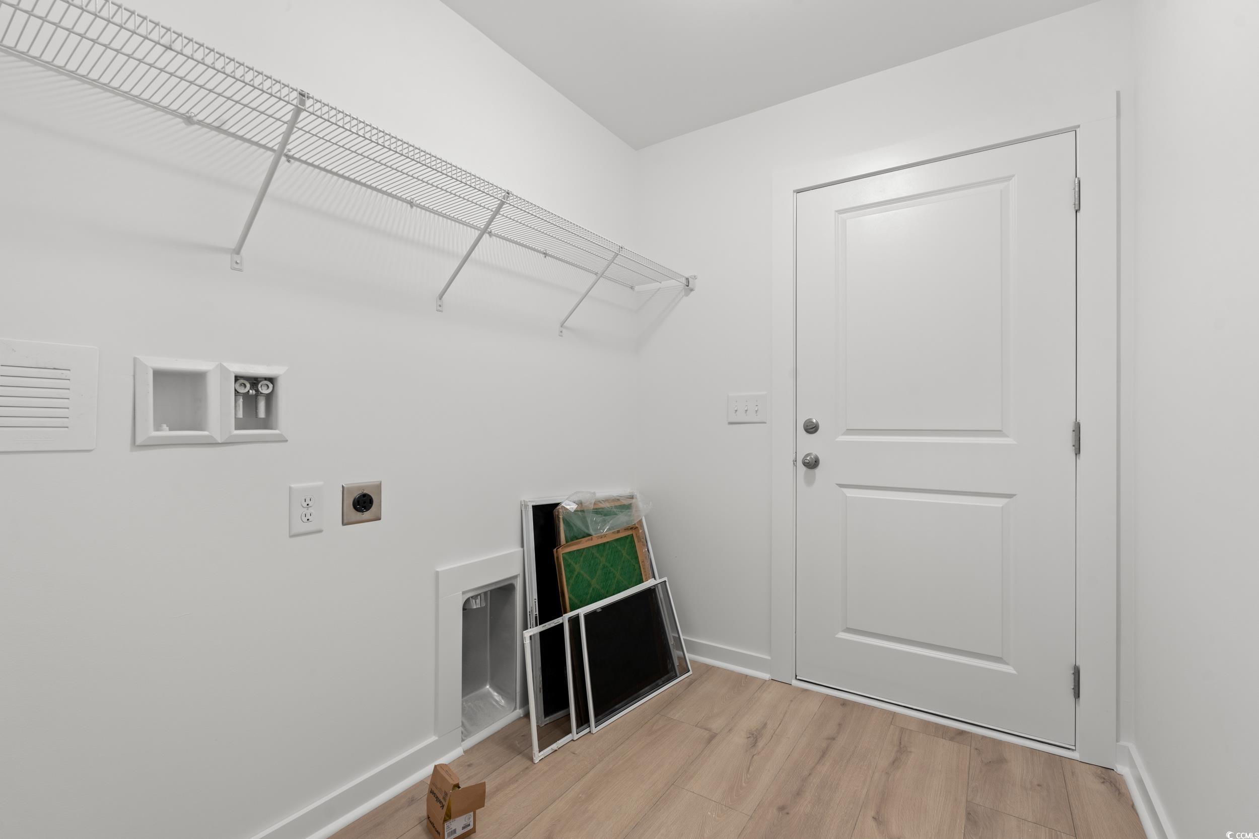 2827 Biscane Court Conway, SC 29527 - Photo 17 of 31 Laundry area with light wood-style flooring, washer hookup, and electric dryer hookup