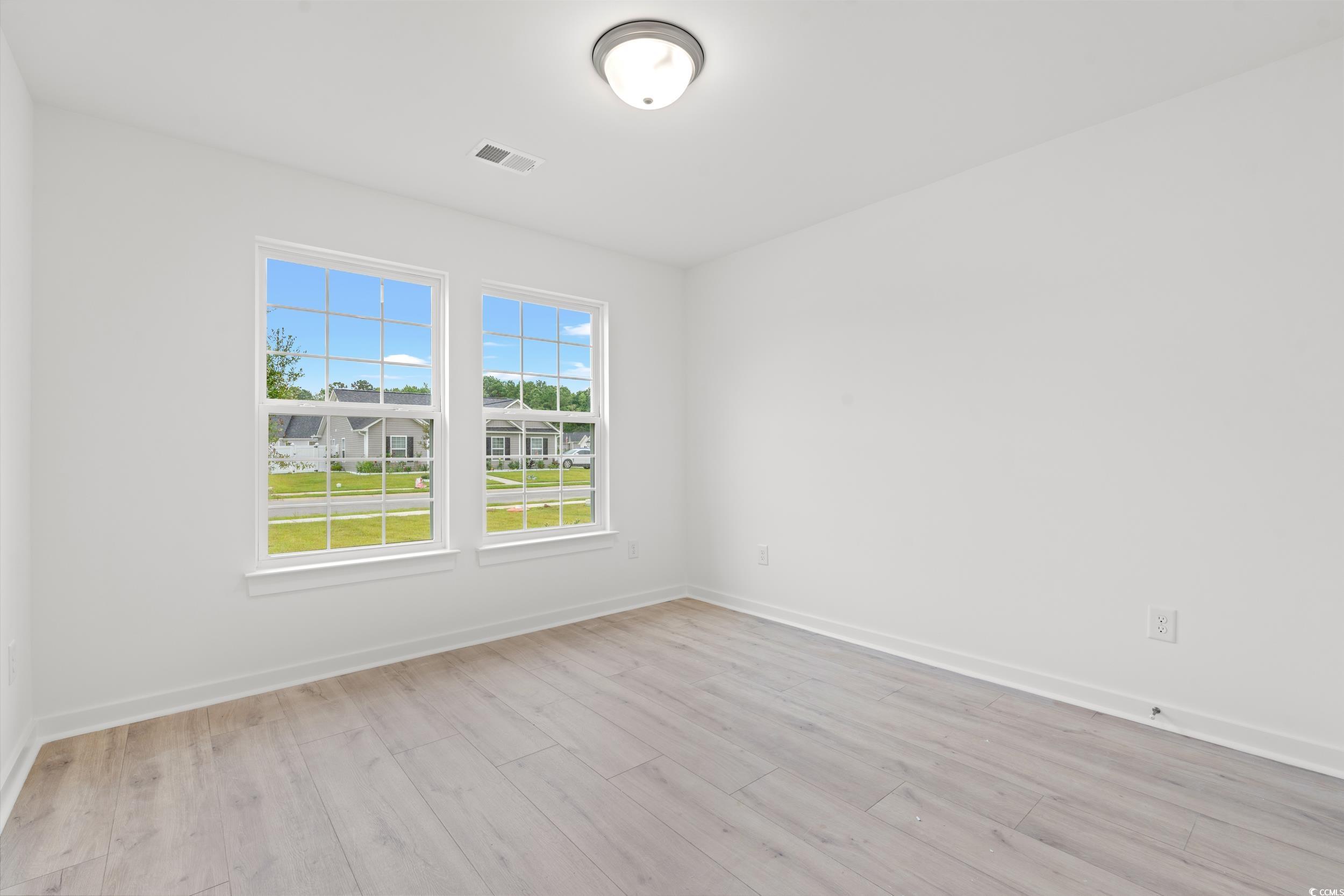 2827 Biscane Court Conway, SC 29527 - Photo 19 of 31 Spare room with light wood-type flooring and baseboards