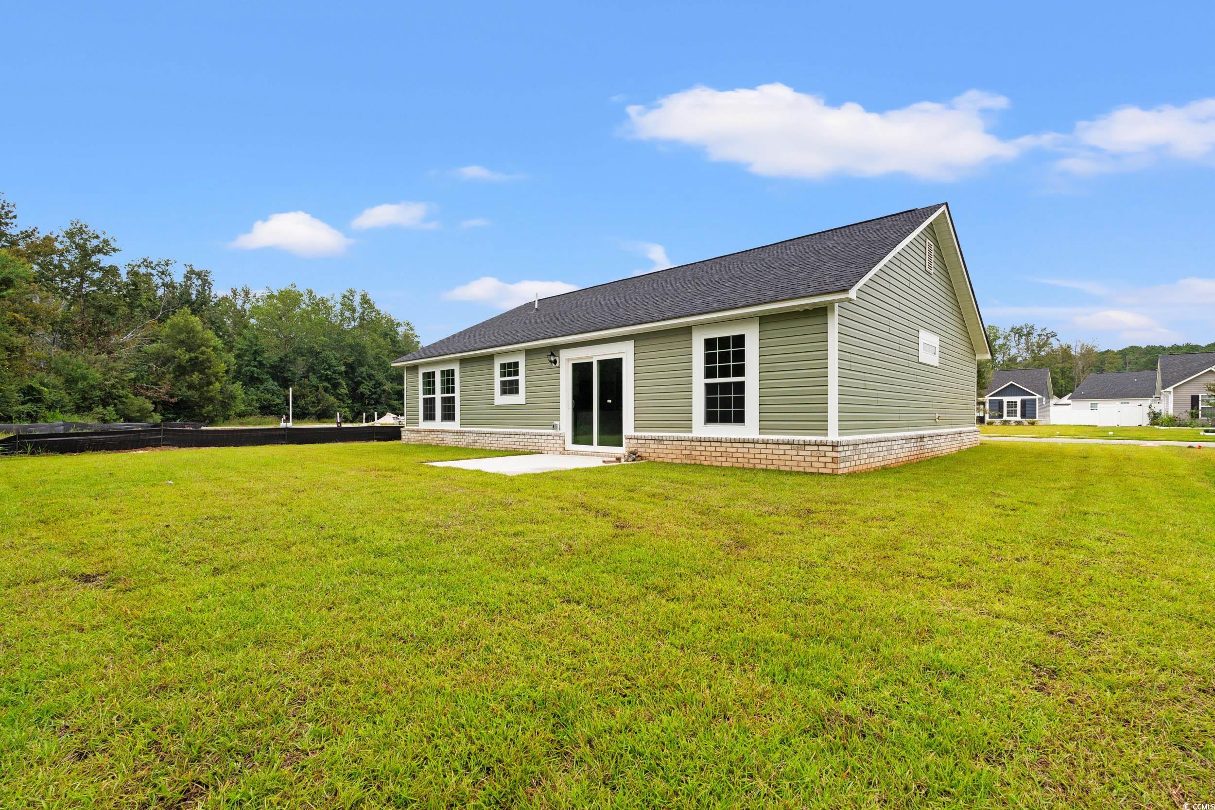 2827 Biscane Court Conway, SC 29527 - Photo 22 of 31 Back of property with a patio, a yard, and a shingled roof