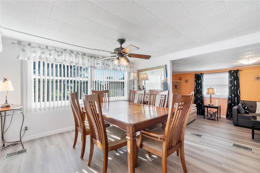 8631 Southwest 20th Street Davie, FL 33324 - Photo 7 of 21 a dining room with furniture window and wooden floor