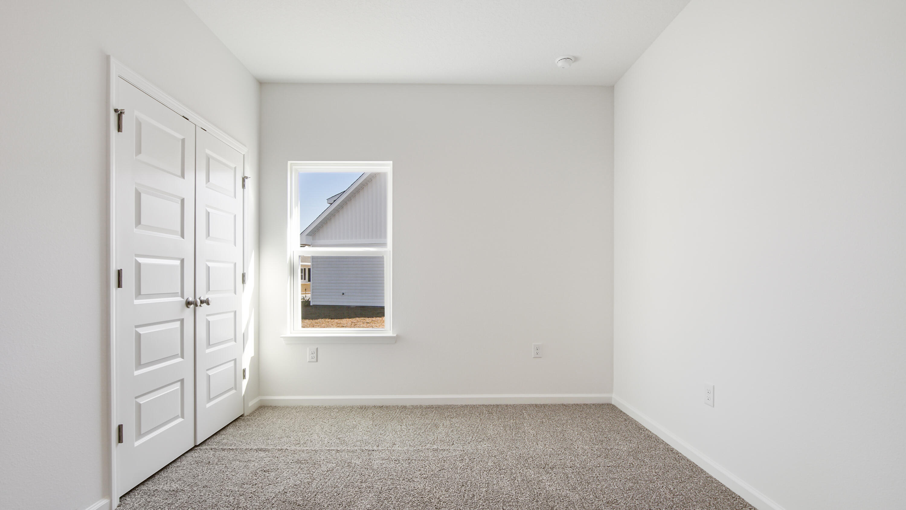 181 Huckleberry Street Freeport, FL 32439 - Photo 7 of 32 an empty room with windows