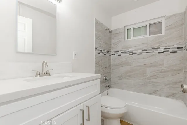 a bathroom with a sink a toilet and a bathtub