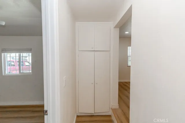 a view of front door with wooden floor