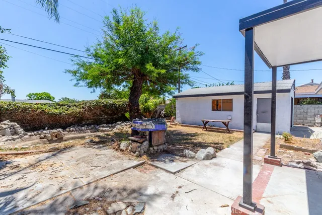 a view of a backyard with a sitting area