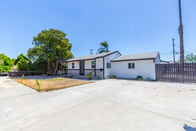 a house with a swimming pool in front of it