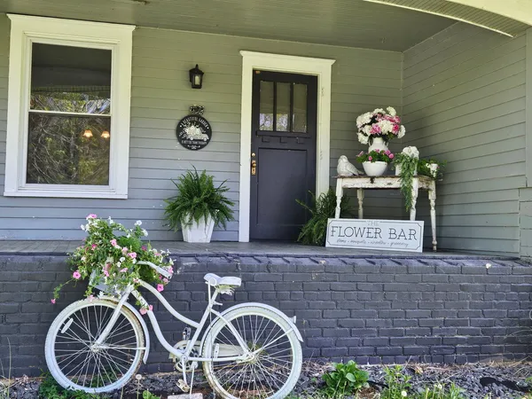 a view of a house with a yard covered with snow in front of house