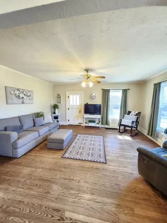 a view of a dining room with furniture and window