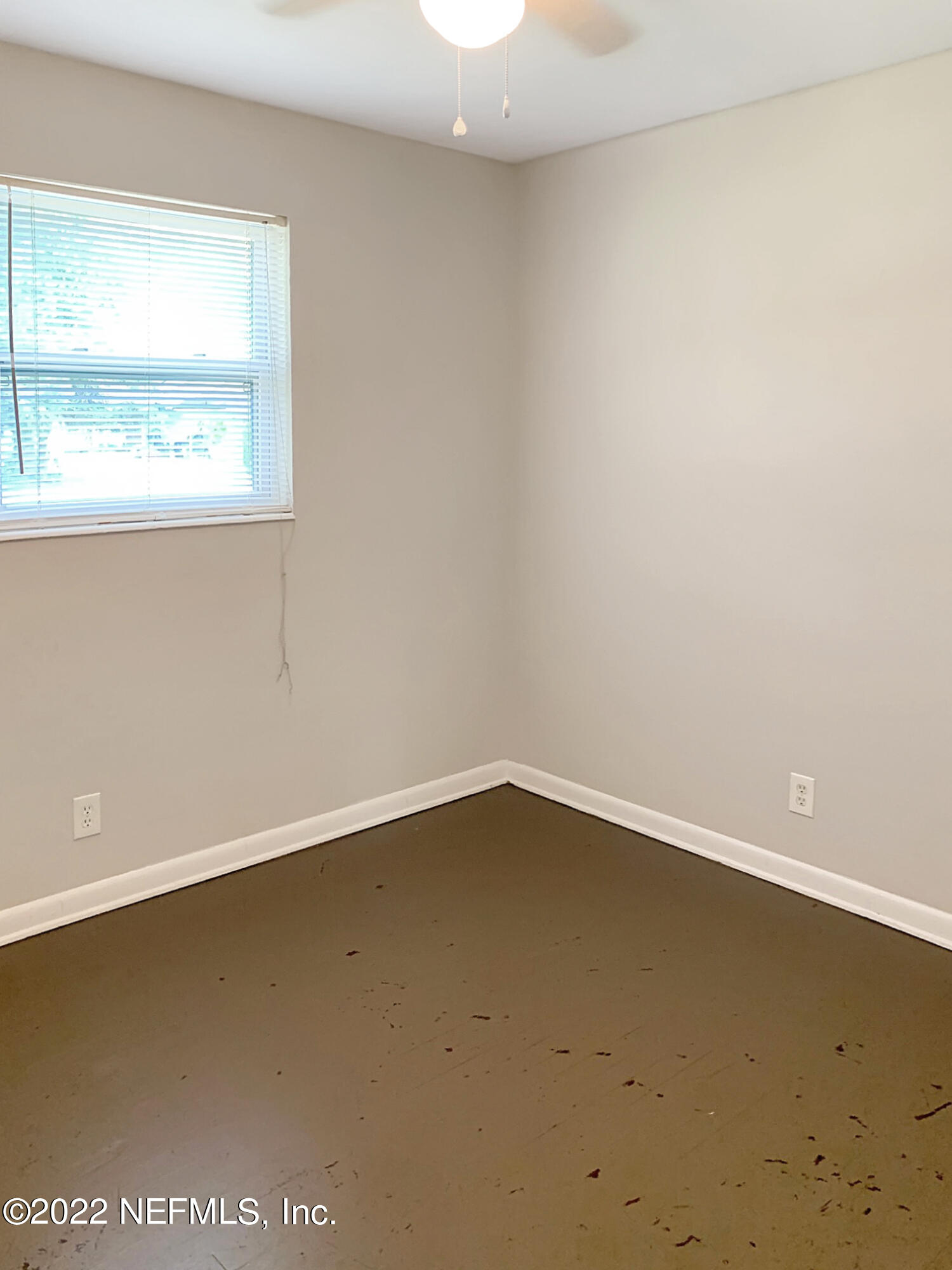 2950 Mansion Road Jacksonville, FL 32277 - Photo 23 of 30 an empty room with a window