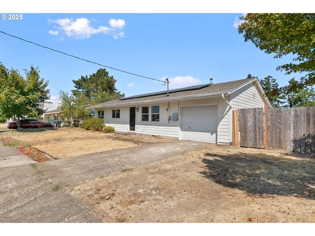 a view of a yard and front view of a house
