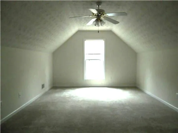 an empty room that has a window