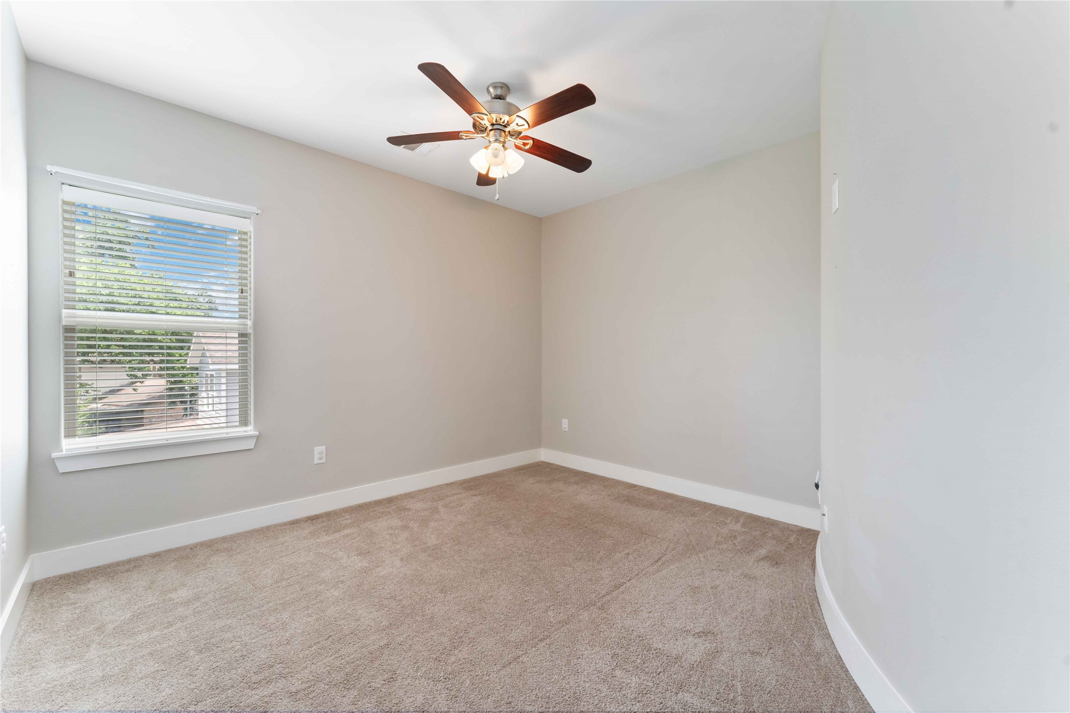 4310 Fernwood Drive Houston, TX 77021 - Photo 23 of 27 an empty room with window and ceiling fan