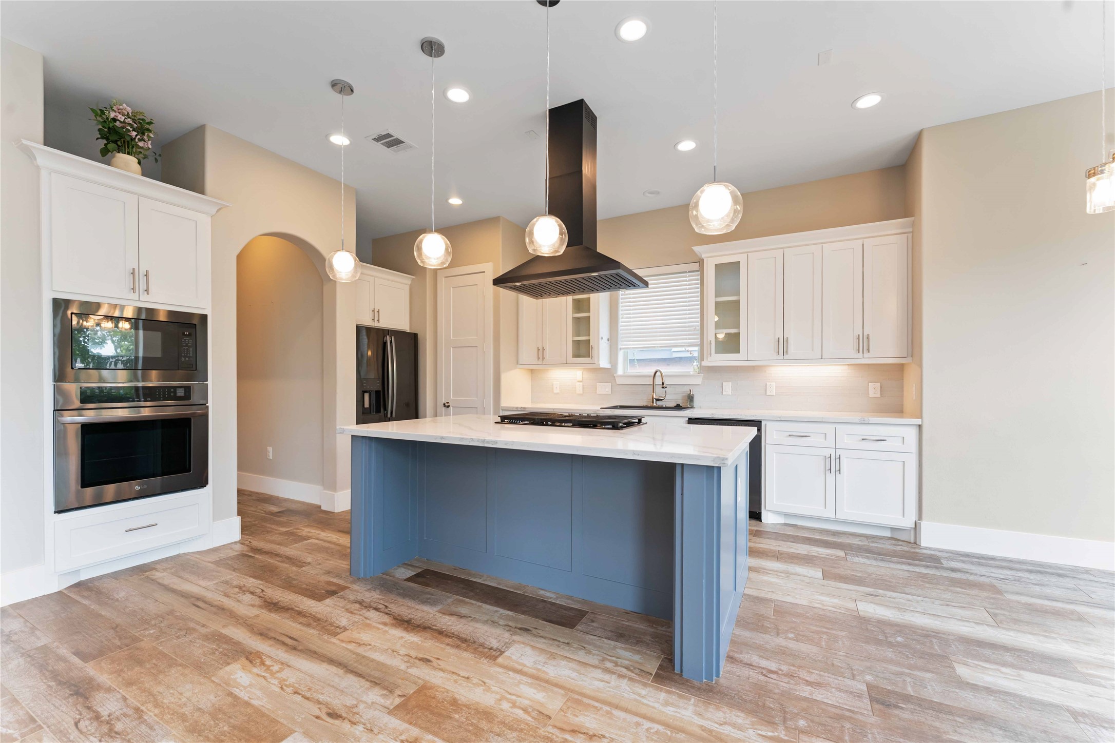 4310 Fernwood Drive Houston, TX 77021 - Photo 6 of 27 a kitchen with stainless steel appliances granite countertop a sink a stove and a refrigerator
