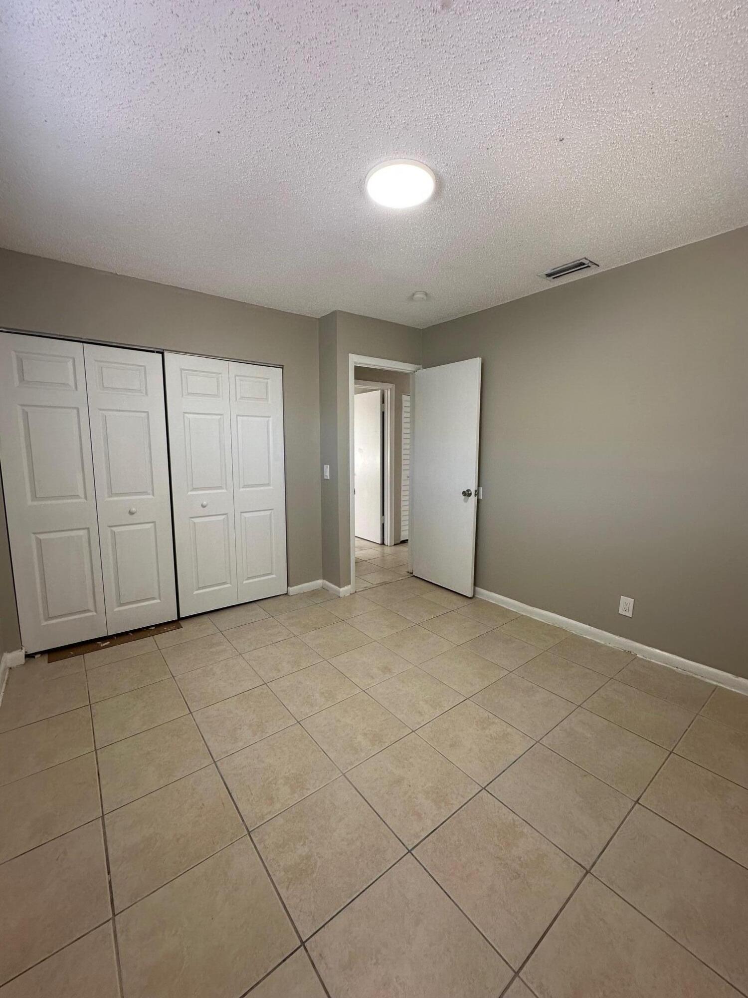 4810 Davis Road, Unit 4818 Lake Worth, FL 33461 - Photo 7 of 12 a view of an empty room