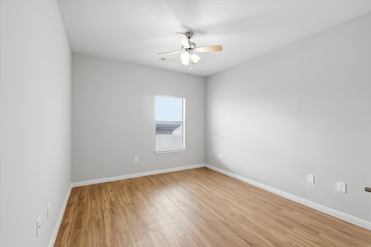 2502 Leon Street, Unit 414 Austin, TX 78705 - Photo 18 of 21 wooden floor in an empty room with a window