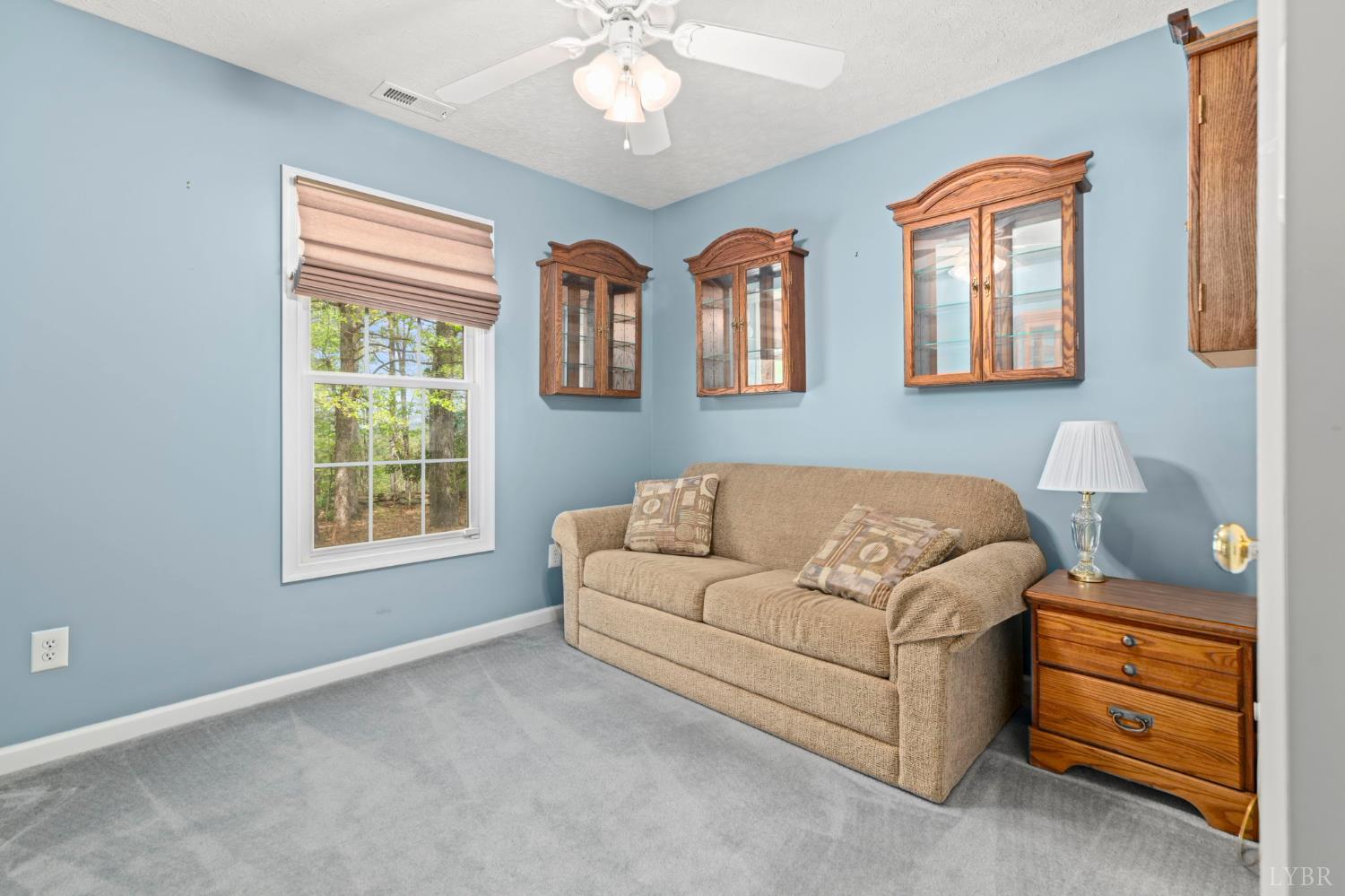 298 Braxton Ridge Road Amherst, VA 24521 - Photo 33 of 65 a living room with furniture and a window