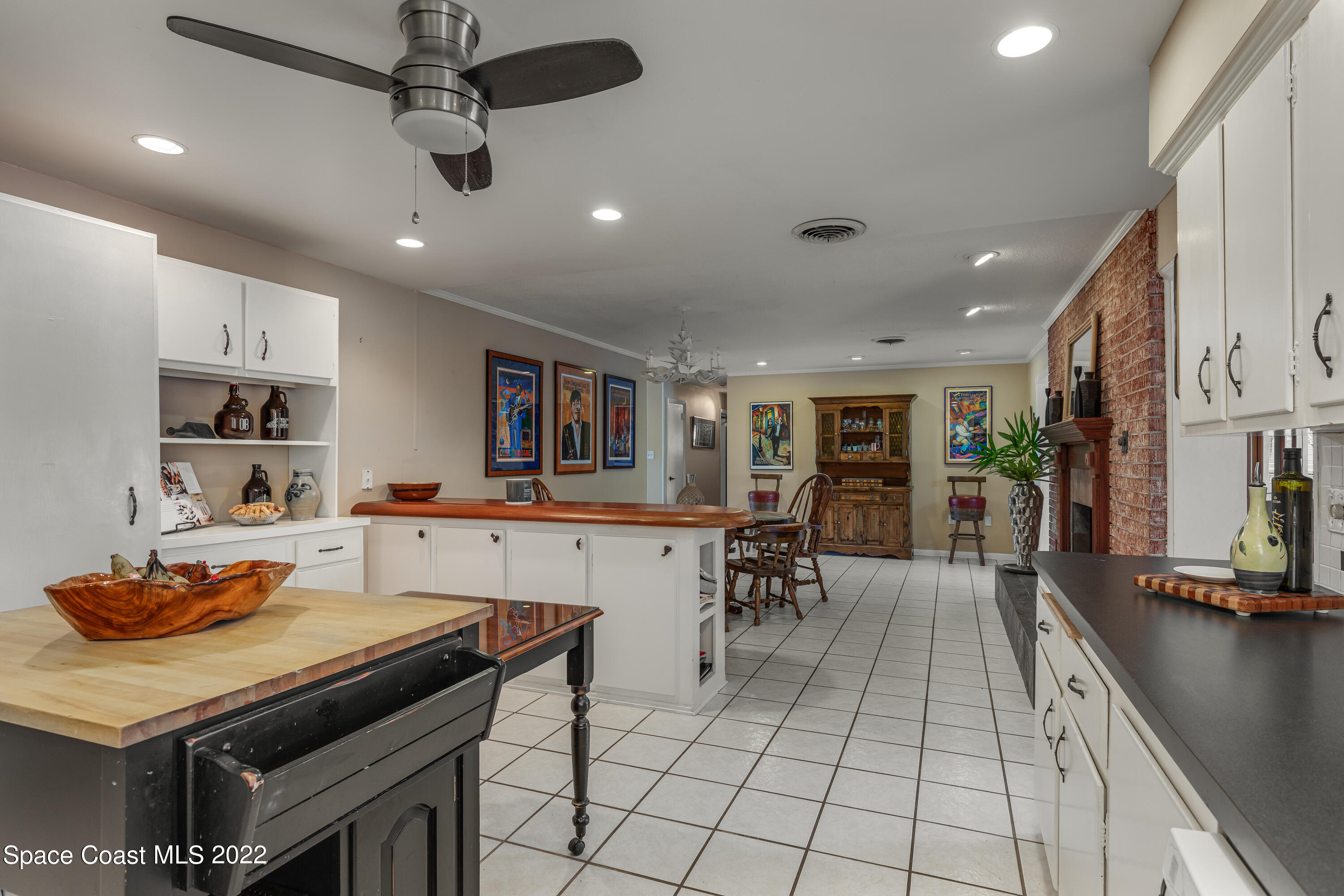 515 Oak Ridge Drive Indialantic, FL 32903 - Photo 11 of 34 a kitchen with a table and chairs in it