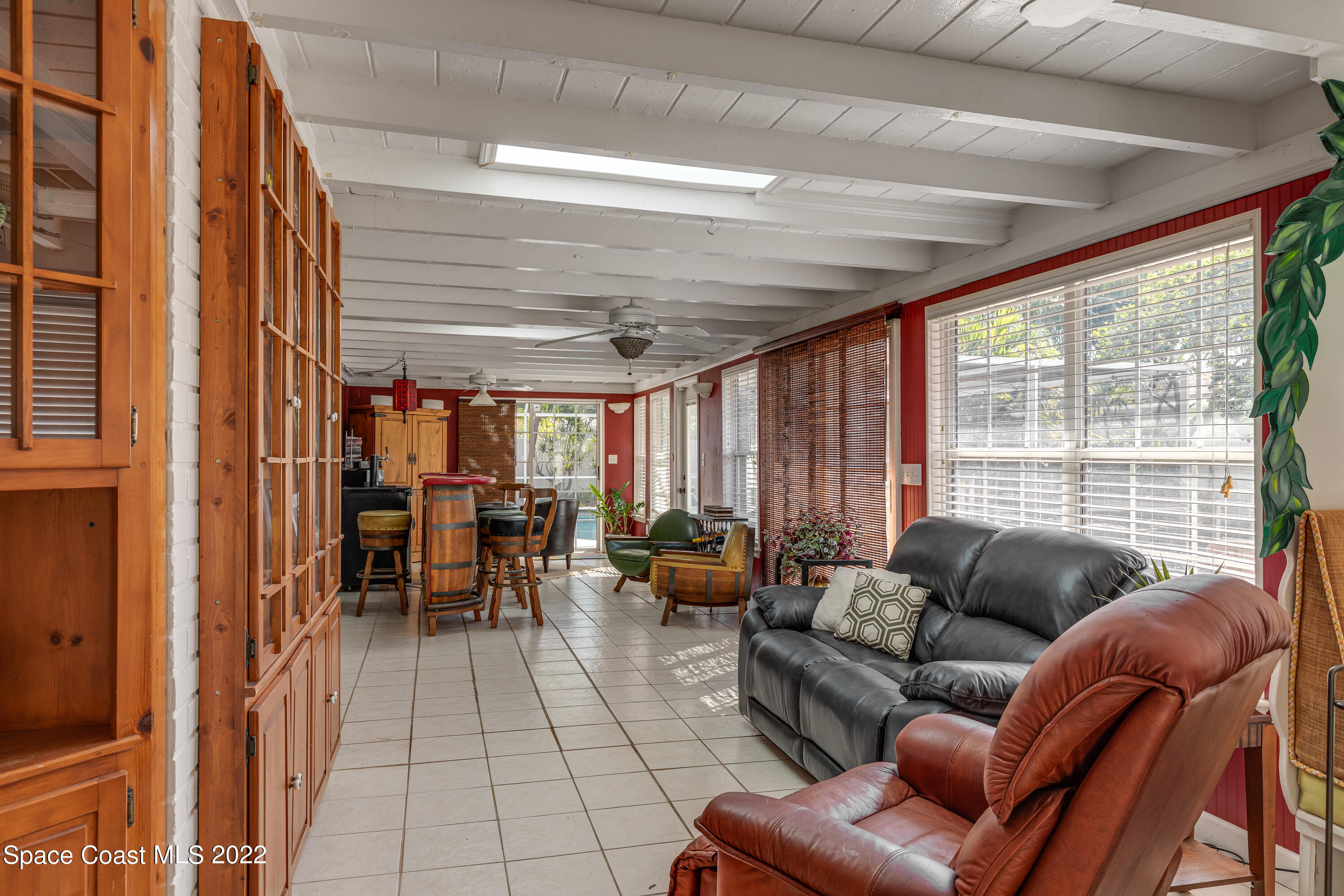515 Oak Ridge Drive Indialantic, FL 32903 - Photo 12 of 34 a living room with furniture and a large window