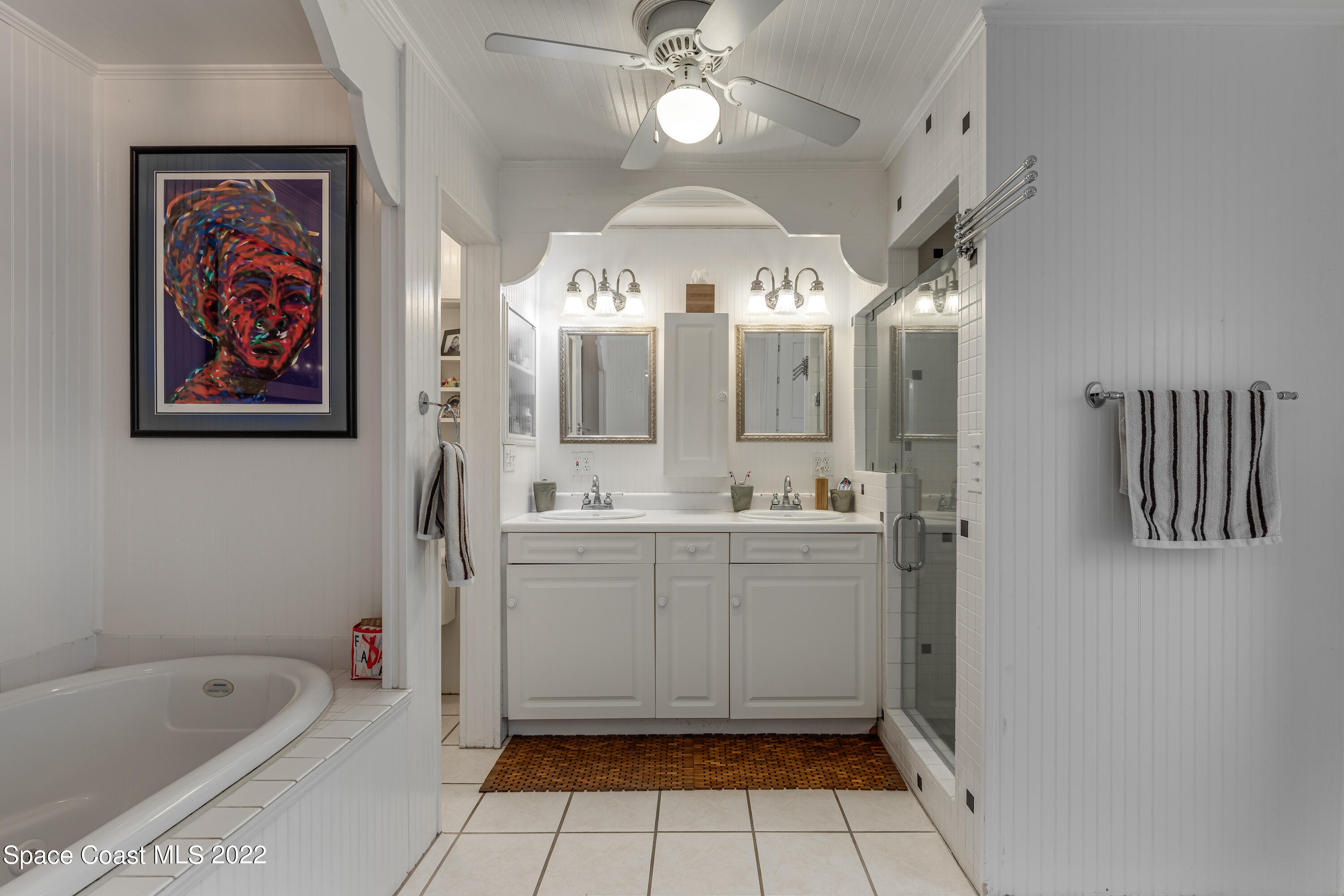 515 Oak Ridge Drive Indialantic, FL 32903 - Photo 15 of 34 a bathroom with a double vanity sink mirror and bathtub