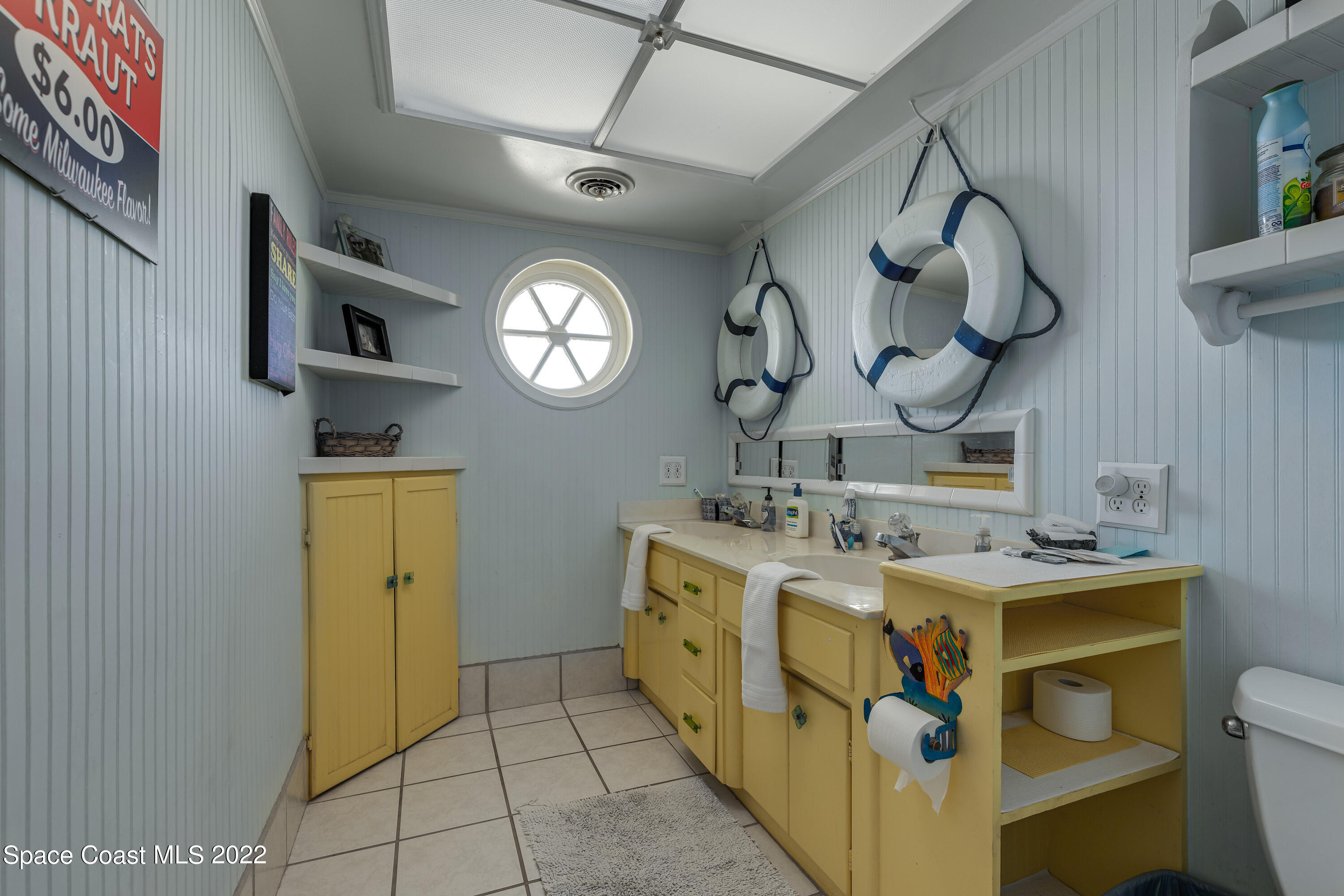 515 Oak Ridge Drive Indialantic, FL 32903 - Photo 19 of 34 a utility room with a stove a washer and dryer