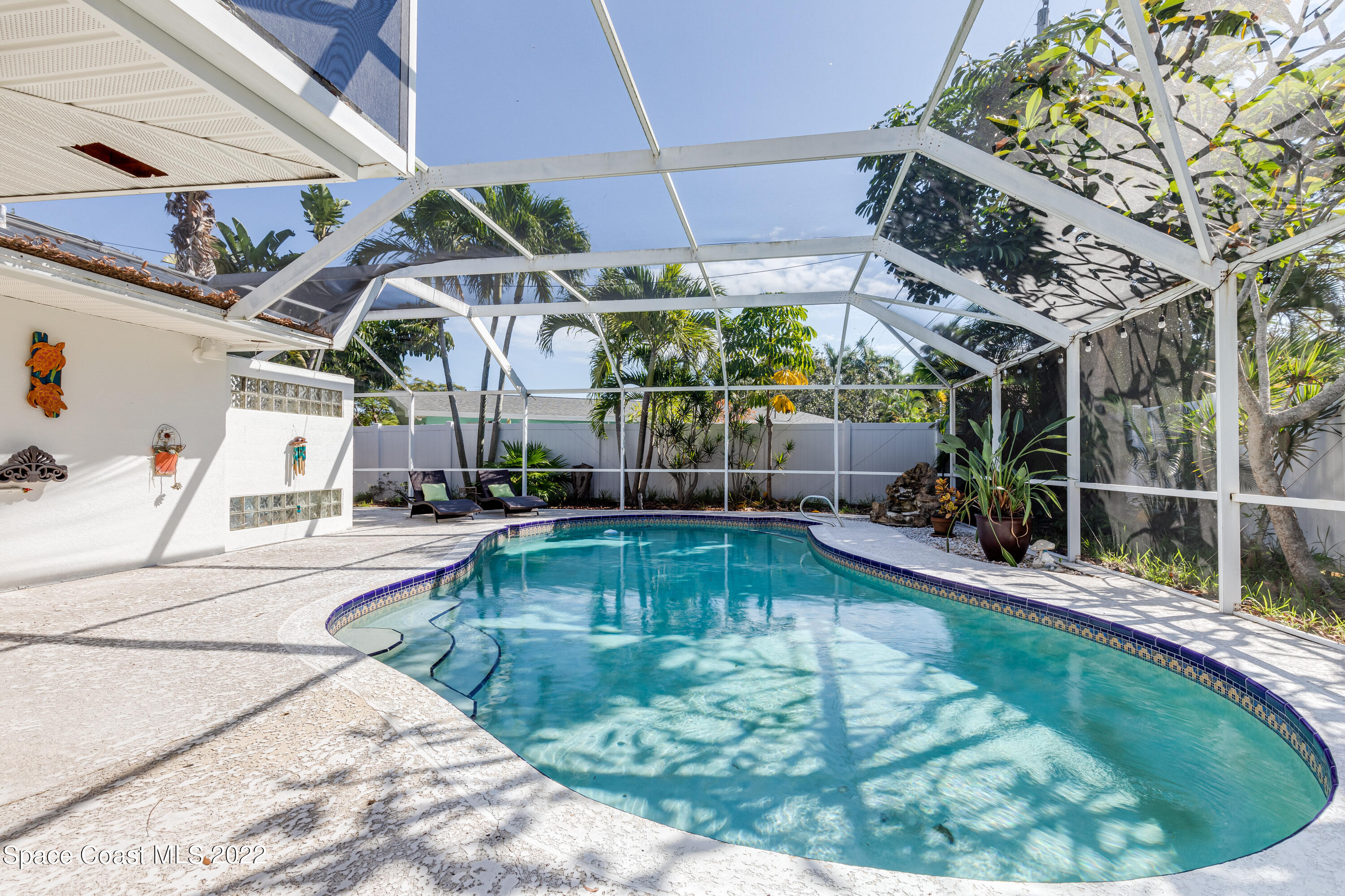 515 Oak Ridge Drive Indialantic, FL 32903 - Photo 21 of 34 a view of a swimming pool with a patio