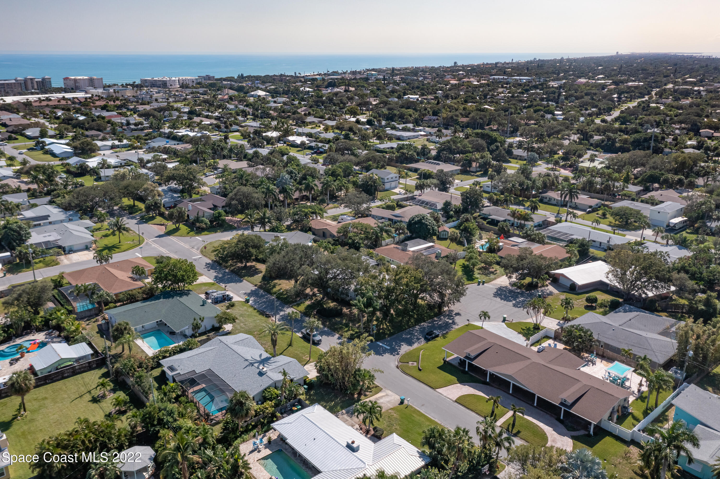 515 Oak Ridge Drive Indialantic, FL 32903 - Photo 30 of 34 an aerial view of a city with lots of residential buildings