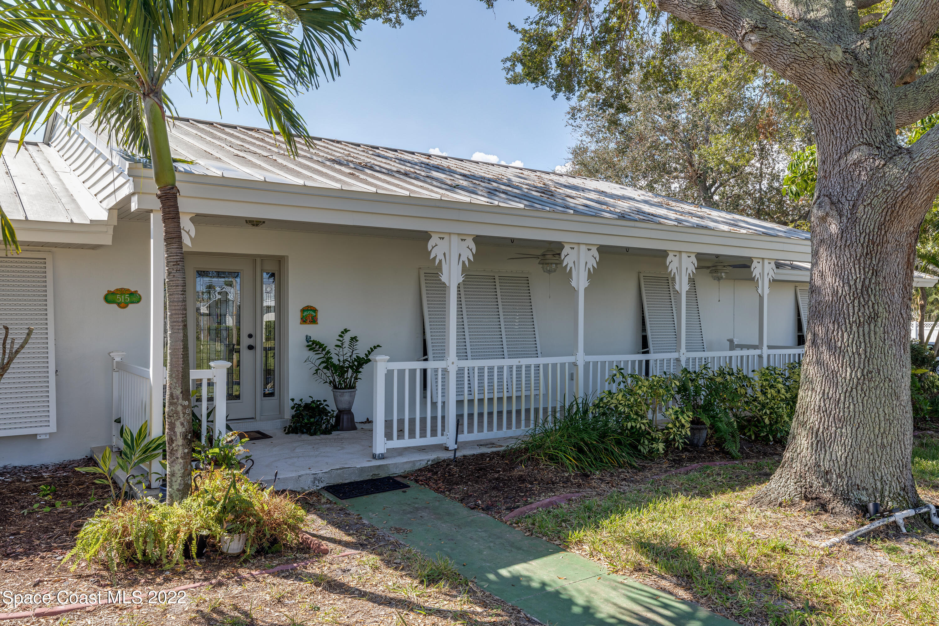 515 Oak Ridge Drive Indialantic, FL 32903 - Photo 4 of 34 front view of a house with a yard