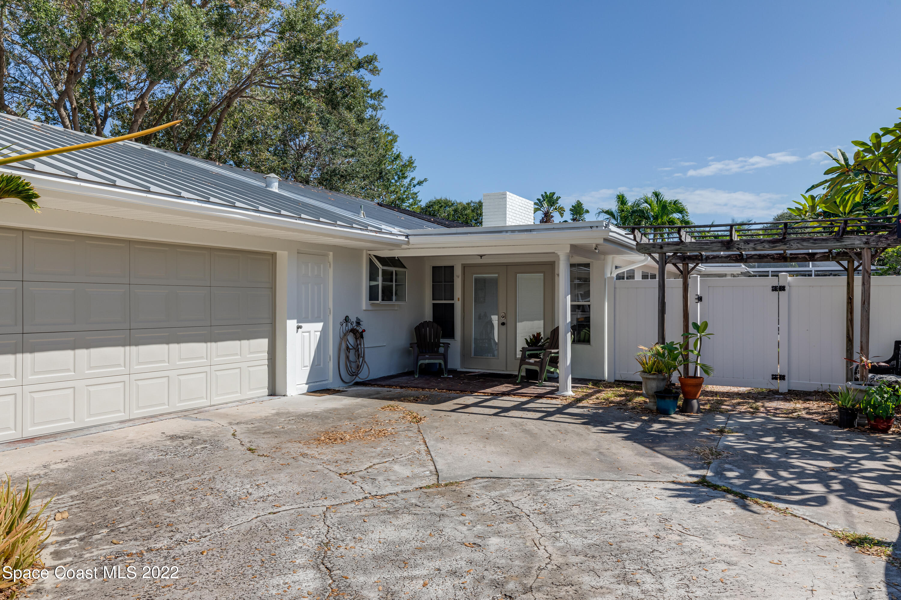 515 Oak Ridge Drive Indialantic, FL 32903 - Photo 5 of 34 a view of a house with patio