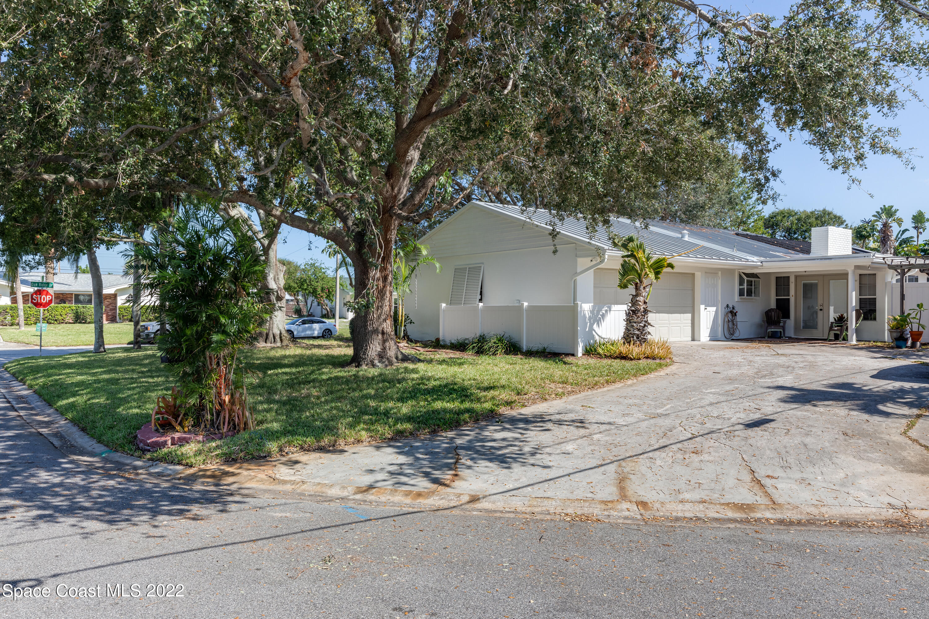 515 Oak Ridge Drive Indialantic, FL 32903 - Photo 6 of 34 a front view of house with a garden