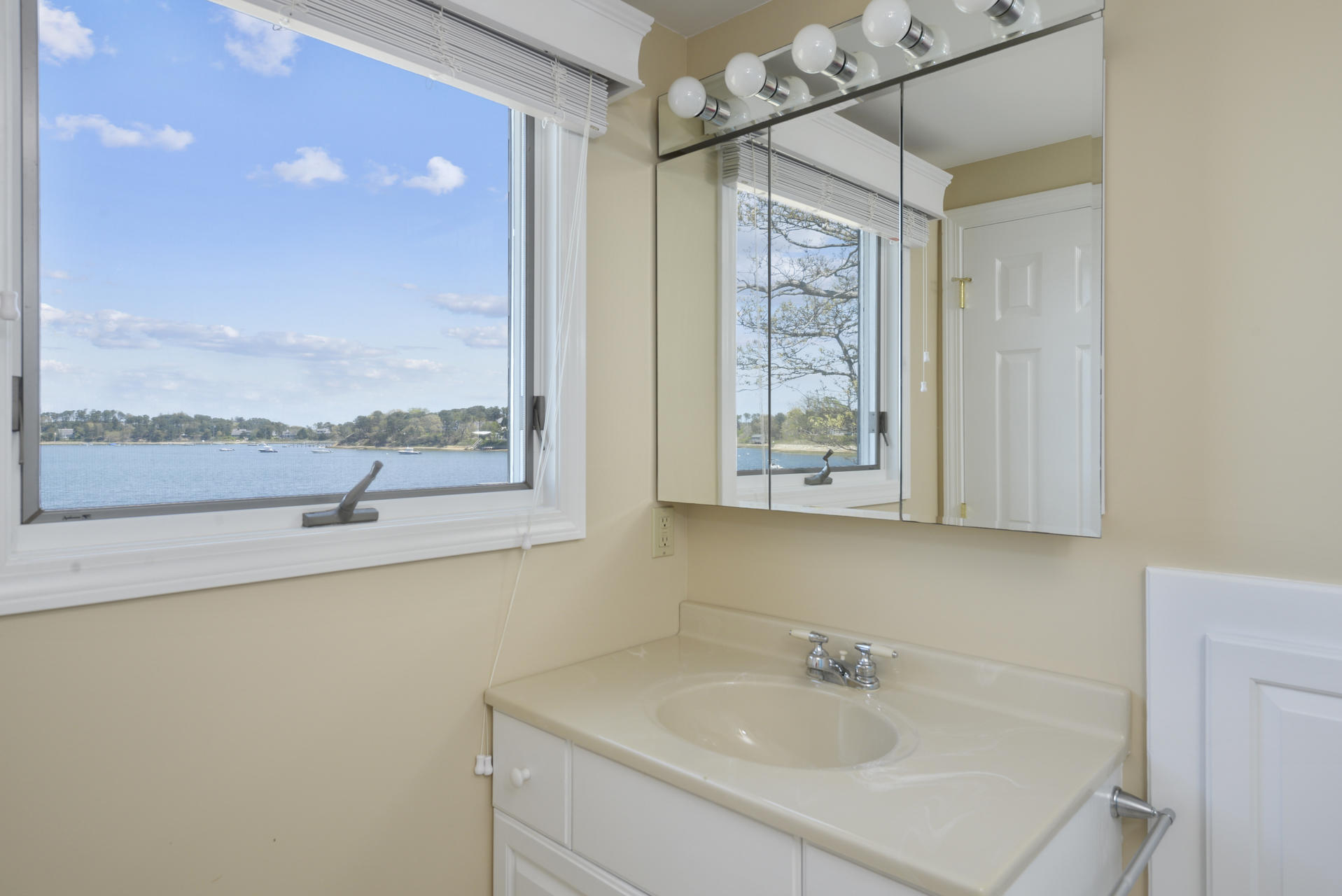159 Seapine Road North Chatham, MA 02650 - Photo 23 of 31 a bathroom with a sink and a large mirror