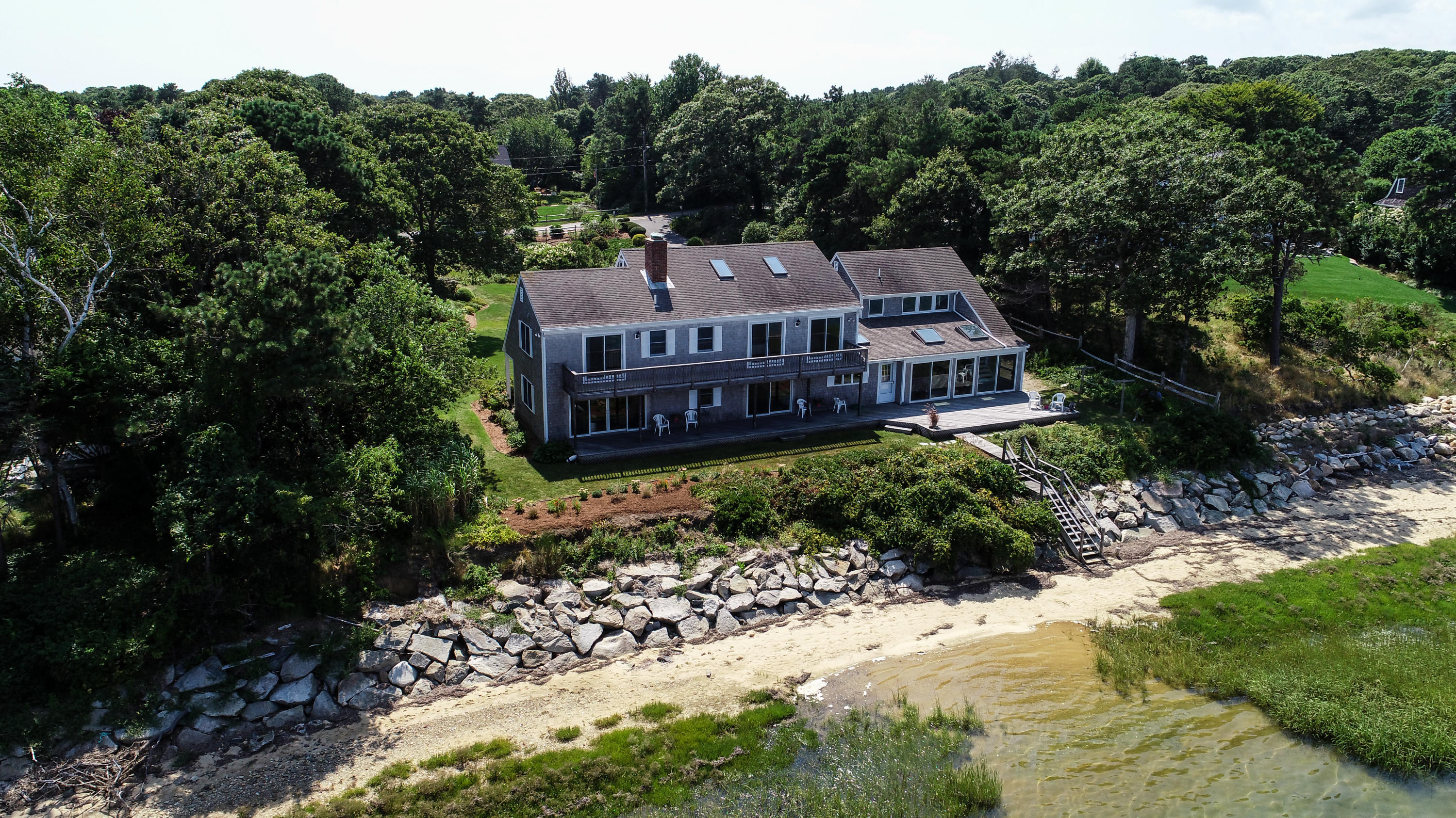 159 Seapine Road North Chatham, MA 02650 - Photo 28 of 31 a view of a big house with a big yard plants and large trees
